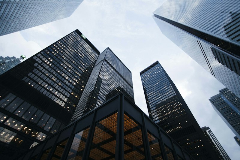 Modern corporate financial towers representing commercial debt and real estate