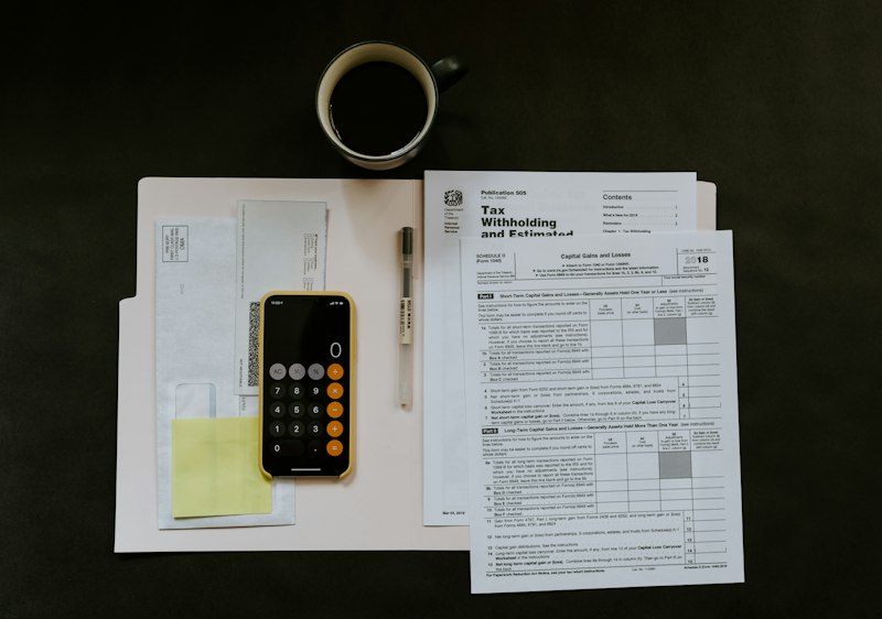Accountant reviewing tax ledger documents and tax deductions